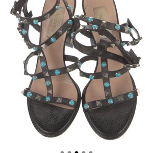Valentino gladiator sandals with rockstud accents.